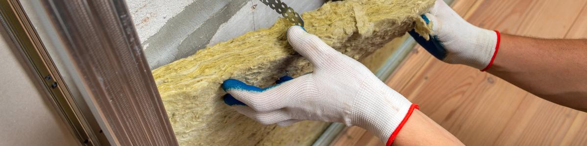 worker-insulating-room-wall-with-mineral-rock-wool-thermal-insulation